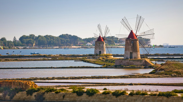 Windmills at the Trapani salt pans in Sicily.
